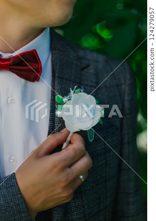 A young groom is very happy on his wedding day and 124279057