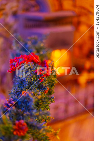 Decorating an iron railing with artificial flowers Decorating an iron railing with artificial flowers 124279074