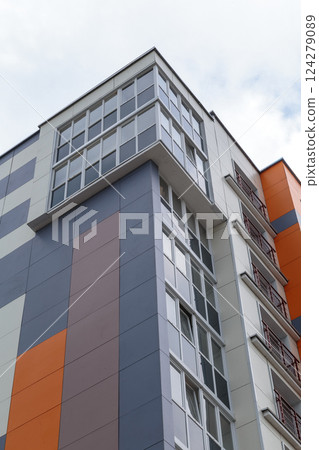 The facade of a modern building in which people The facade of a modern building in which people 124279089