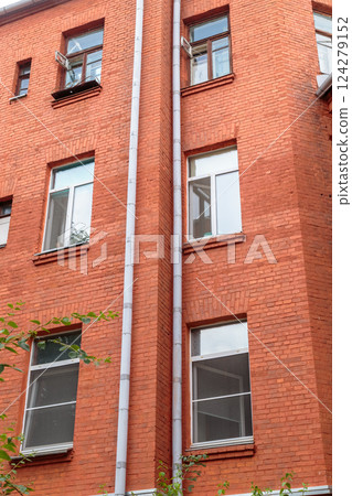 The facade of the old red brick building that was 124279152