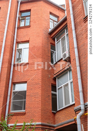 The facade of the old red brick building that was The facade of the old red brick building that was 124279154