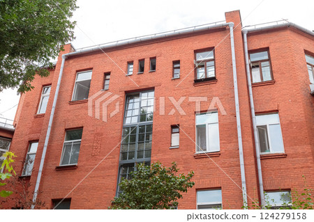 The facade of the old red brick building that was The facade of the old red brick building that was 124279158