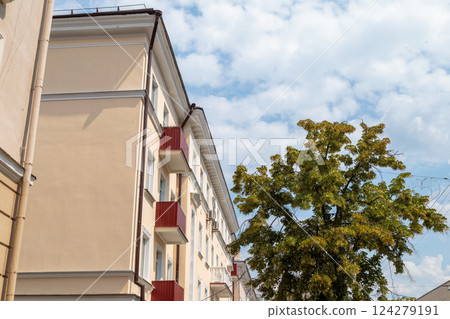 The facade of a modern building in which people 124279191