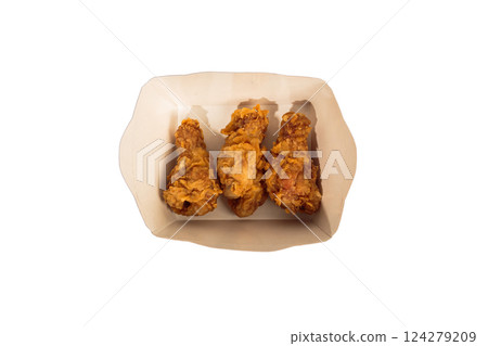 Fried chicken wings in batter in a package on a Fried chicken wings in batter in a package on a 124279209