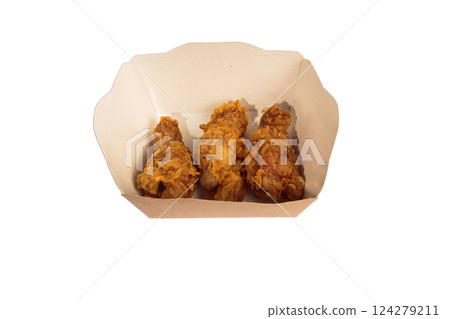 Fried chicken wings in batter in a package on a Fried chicken wings in batter in a package on a 124279211