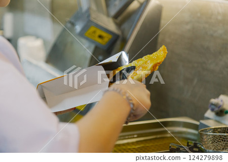 Cook woman lays a fried Cheburek Special Package Cook woman lays a fried Cheburek Special Package 124279898