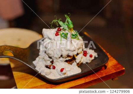 Appetizing pancakes from potatoes doused with sour Appetizing pancakes from potatoes doused with sour 124279906