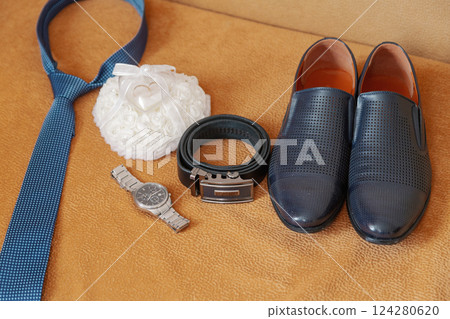 Groom's accessories on the sofa shoes strap watch 124280620
