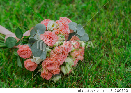A beautiful wedding bouquet of fresh flowers lies A beautiful wedding bouquet of fresh flowers lies 124280700