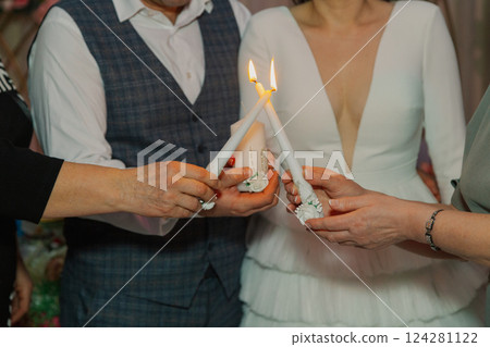 The newlyweds at the wedding ceremony sets fire to The newlyweds at the wedding ceremony sets fire to 124281122
