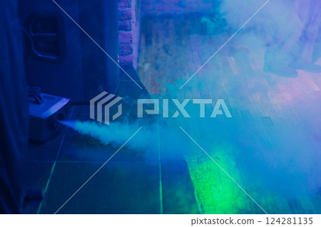 The smoke from the smoke machine comes out 124281135