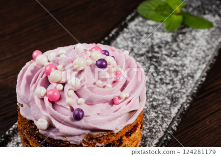 Appetizing fresh dessert cake on a black plate 124281179