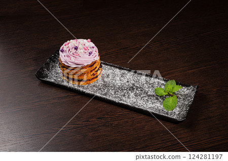 Appetizing fresh dessert cake on a black plate 124281197
