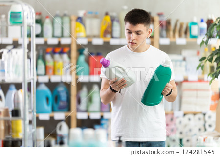 Male consumer with household chemical products for washing indoors 124281545