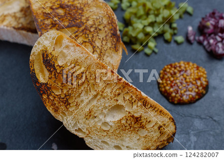 Beef tartare. Cold appetizer of raw marinated meat Beef tartare. Cold appetizer of raw marinated meat 124282007