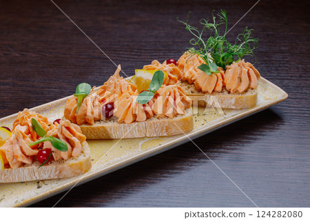 White bread sandwiches with fish cream and herbs 124282080