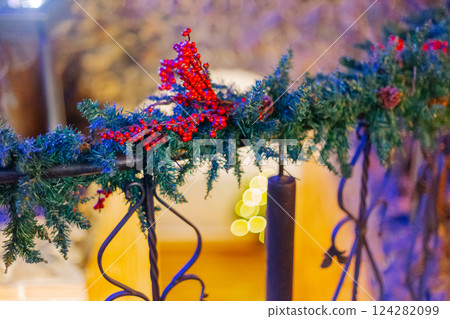 Beautiful fresh flowers on the iron railing in a 124282099