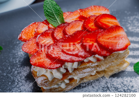 Appetizing dessert of strawberries and puff pastry 124282100