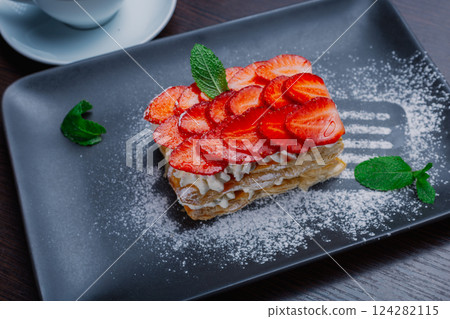 Appetizing dessert on a plate with fresh 124282115