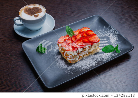 Appetizing dessert on a plate with fresh 124282118
