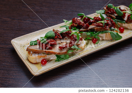 Appetizing sandwiches with meat, greens and 124282136