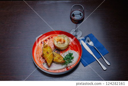 Grilled fresh red fish lies on a plate along with Grilled fresh red fish lies on a plate along with 124282161