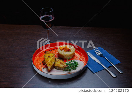 Grilled fresh red fish lies on a plate along with 124282170