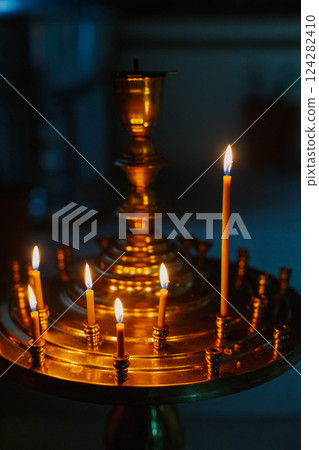 ambiance of church, candles and bokeh yellow ambiance of church, candles and bokeh yellow 124282410