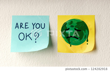 World Earth Day Concept. a Message on Sticky Note represent Caring and Encouraging the Tired Green Globe. 124282918
