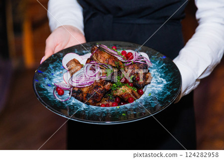 Grilled meat with baked vegetables on a plate in Grilled meat with baked vegetables on a plate in 124282958