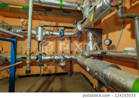 Technical heating pipes in the basement of a 124283053