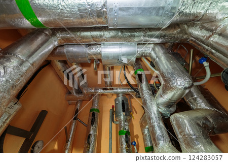 Technical pipes for sewerage in the basement of a 124283057