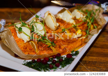 Baked fresh red fish on papyrus in a plate with Baked fresh red fish on papyrus in a plate with 124283069