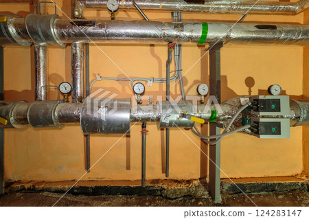 Technical pipes for sewerage in the basement of a Technical pipes for sewerage in the basement of a 124283147