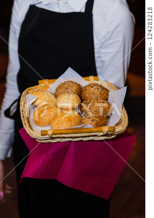 Bread basket with white and black bread in the 124283218