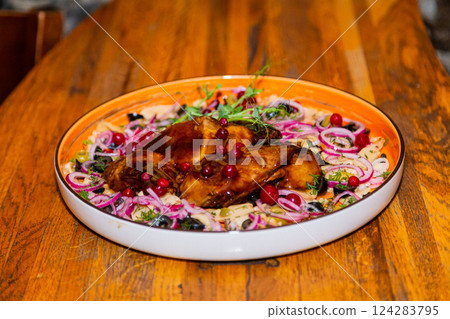 Braised pork with vegetables on a plate in a Braised pork with vegetables on a plate in a 124283795