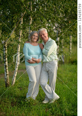 Romantic elderly senior couple embracing in nature Romantic elderly senior couple embracing in nature 124285759