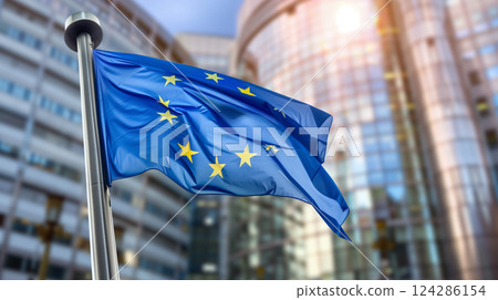 EU flag waving in front of European Parliament building. 124286154