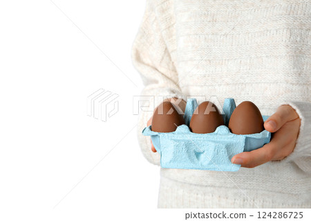 Easter, Person holds a carton of brown eggs, isolated on white, PNG 124286725