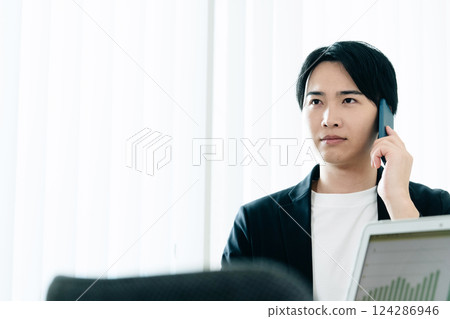 Businessmen talking on a smartphone 124286946