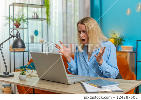 Nervous stressed businesswoman manager quarreling laptop call talk online conflict at home office Nervous stressed businesswoman manager quarreling laptop call talk online conflict at home office 124287503