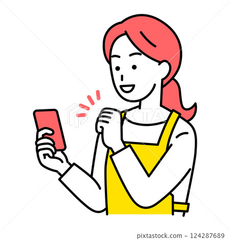A woman in an apron looking at her smartphone screen and giving a fist pump in delight 124287689