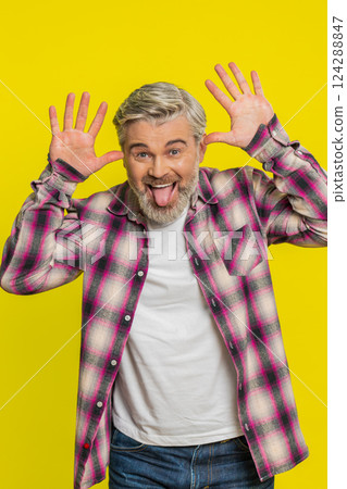 Mature man sticking out tongue, playful goofy expression, comedic silly face teasing humor vibe Mature man sticking out tongue, playful goofy expression, comedic silly face teasing humor vibe 124288847