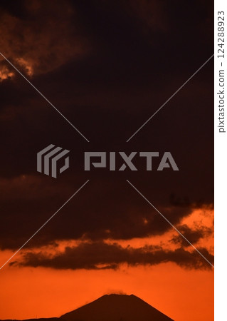 Clouds and mountains dyed in the sunset Clouds and mountains dyed in the sunset 124288923