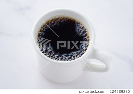 An image of someone enjoying a relaxing time while drinking freshly brewed, aromatic coffee An image of someone enjoying a relaxing time while drinking freshly brewed, aromatic coffee 124289280