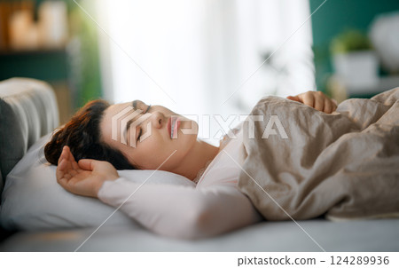 Woman is sleeping in her bedroom Woman is sleeping in her bedroom 124289936