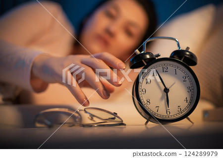 Woman is sleeping in her bedroom 124289979