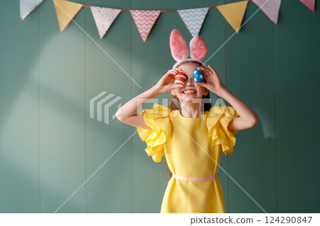 Girl with painted eggs Girl with painted eggs 124290847