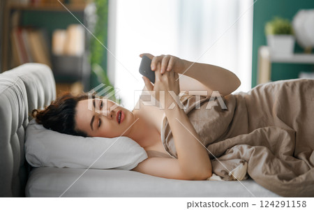 woman is using a phone woman is using a phone 124291158