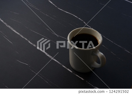 White mug with freshly brewed coffee White mug with freshly brewed coffee 124291502